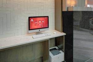 a computer monitor sitting on a counter in a room at Cincinnati Marriott at RiverCenter in Covington