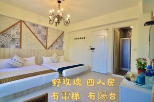 Postel nebo postele na pokoji v ubytování 花蓮雲朵朵民宿 電梯附停車場