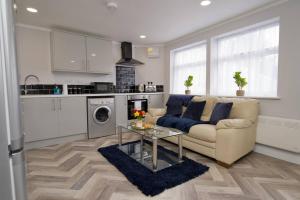 a living room with a couch and a table at Dane Apartment 12 – Coventry in Coventry