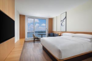 Ein Bett oder Betten in einem Zimmer der Unterkunft Fairfield by Marriott Hangzhou Qiandao Lake