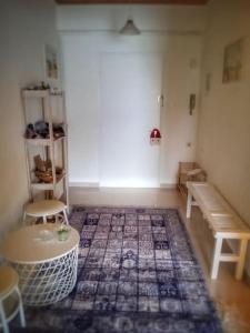 a room with a room with a rug on the floor at Skiff_View in Kastoria