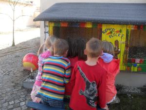 a group of children standing in front of a play structure at Ferienhaus Duhra in Peitz