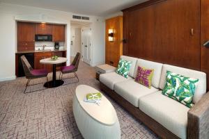 a living room with a couch and a kitchen at Marriott's Kaua'i Beach Club in Lihue