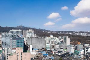 a view of a city with tall buildings at Moxy Seoul Insadong in Seoul