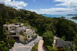 an aerial view of a house with a view of the ocean at Bayview Panorama - Paihia Holiday Home in Paihia