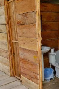 a bathroom with a toilet and a sink at Cabañas sobre el mar en Guna Yala in Playón Chico