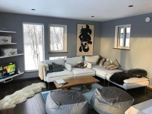 a living room with a couch and a table at Forest Hideaway - Vacation STAY 09982v in Niseko