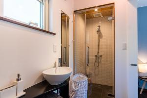 a bathroom with a sink and a shower at Forest Hideaway - Vacation STAY 09982v in Niseko