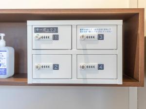 a set of four electrical boxes on a shelf at Tabist New Gekkoen in Shimminatomachi