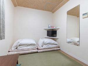 a room with two bean bags on the floor at Tabist New Gekkoen in Shimminatomachi
