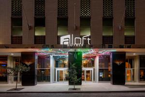 a store front of a building at night at Aloft by Marriott New Orleans Downtown in New Orleans