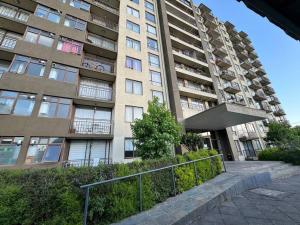 a tall building with a staircase in front of it at Departamento Park Collao Suit - Empresas Factura - Parking - wifi in Concepción