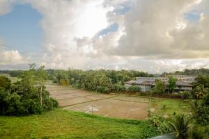 an aerial view of a tennis court with trees at AGP Greeny View Resident in Galle