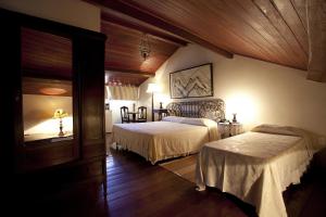 Posteľ alebo postele v izbe v ubytovaní Pousada dos Quatro Cantos