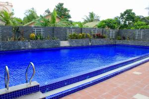 a swimming pool in a house with blue water at Summer Dream Hotel in Phú Quốc