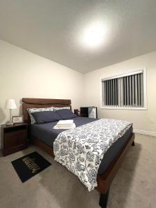 a bedroom with a bed and a window at Niagara Falls BNB 15 mins away from Falls in Thorold