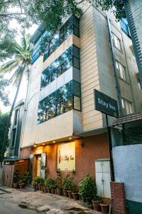 a building with a street sign in front of it at HOTEL STAY INN in Bengaluru