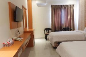 Tempat tidur dalam kamar di Agape Hotel Haranggaol