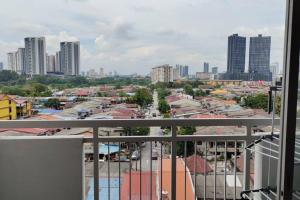 a view of a city from a balcony at CANA Homestay Petaling Jaya in Petaling Jaya