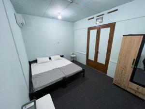 Postel nebo postele na pokoji v ubytování Faire BNB Homestay