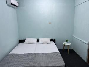 Postel nebo postele na pokoji v ubytování Faire BNB Homestay
