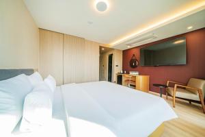 TV a/nebo společenská místnost v ubytování Hound Hotel Ulsan