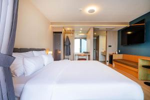 Postel nebo postele na pokoji v ubytování Hound Hotel Ulsan