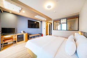 TV a/nebo společenská místnost v ubytování Hound Hotel Ulsan