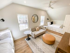 a living room with a bed and a couch at Camp Hideaway Gruene in New Braunfels +37 photos