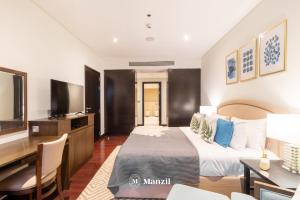 Postel nebo postele na pokoji v ubytování Manzil - 1BR in Anantara The Palm with Private Beach & Burj View, Palm Jumeirah + 12 fotografií