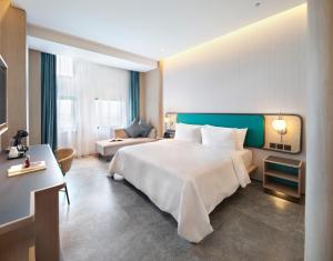 Voodi või voodid majutusasutuse VIVERE Hotel, ARTOTEL Curated toas +32 fotot