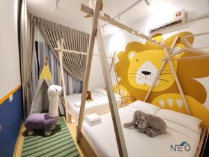 a childs bedroom with two beds with stuffed animals at Country Garden Danga Bay InStyle Sea View Homestay Suite by NEO in Johor Bahru