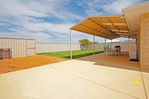 a covered patio with a table and chairs at Fishface Retreat in Jurien Bay