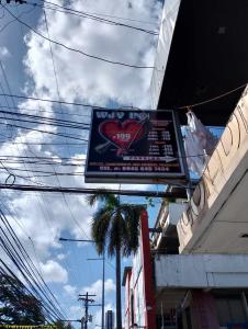 a sign for a shop with a heart on it at WJV INN PALAWAN in Puerto Princesa City