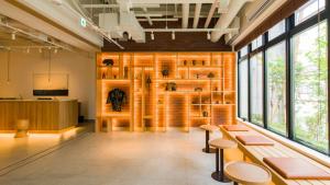 a room with benches and windows in a building at GRIDS PREMIUM HOTEL OTARU in Otaru