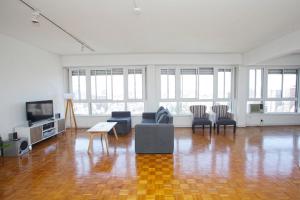 a large living room with a couch and chairs at Spacious 5BR Classic Apt in Palermo in Buenos Aires