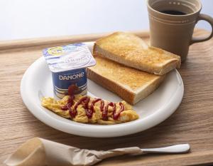 a plate of breakfast food with toast and jam and a cup of coffee at Hotel Jardin de Fleurs (Adult Only) in Kyoto