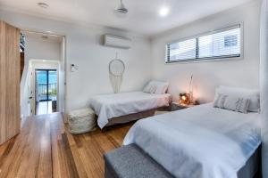 Ένα ή περισσότερα κρεβάτια σε δωμάτιο στο Panorama 4 & Buggy - Hamilton Island