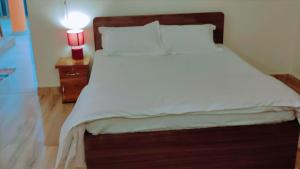 Cama ou camas em um quarto em The ROI Palace