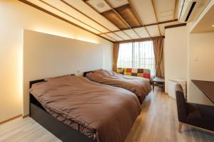 Postel nebo postele na pokoji v ubytování The Hotel Obuse
