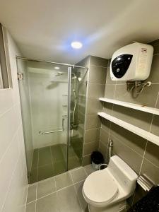 a bathroom with a shower stall and a toilet at SCENIC VALLEY 1 in Ho Chi Minh City