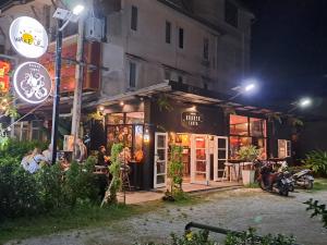 a building with a restaurant at night at WAKE UP @Lanta Hotel : Cafe in Ko Lanta