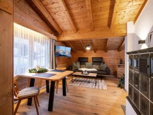 Televízia a/alebo spoločenská miestnosť v ubytovaní Ferienwohnung HOAMAT