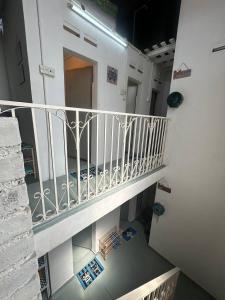 an overhead view of a staircase in a building at SPOT ON 90898 Kasturi Alley Guest House & Cat Hotel in Melaka