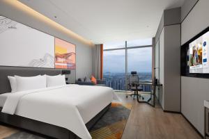 Ένα ή περισσότερα κρεβάτια σε δωμάτιο στο Hampton by Hilton Hangzhou Liangzhu