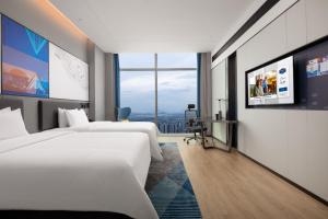 Μια τηλεόραση ή/και κέντρο ψυχαγωγίας στο Hampton by Hilton Hangzhou Liangzhu