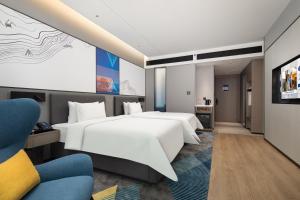 Ένα ή περισσότερα κρεβάτια σε δωμάτιο στο Hampton by Hilton Hangzhou Liangzhu