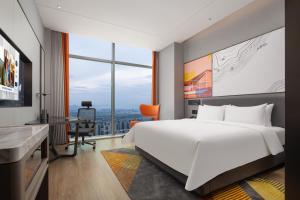 Ένα ή περισσότερα κρεβάτια σε δωμάτιο στο Hampton by Hilton Hangzhou Liangzhu