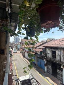 a view of a city street from a building at SPOT ON 90898 Kasturi Alley Guest House & Cat Hotel in Malacca