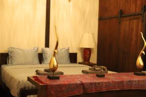 Postel nebo postele na pokoji v ubytování Shanti Boutique Hotel